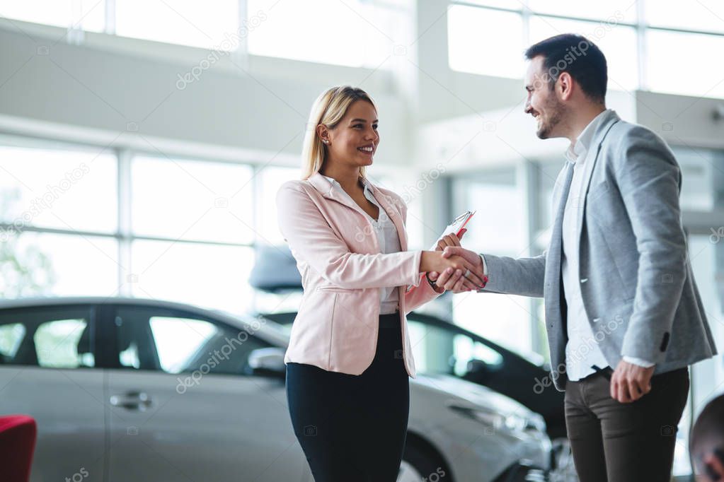 auto business, car sale, consumerism and people concept - happy man at auto show or salon