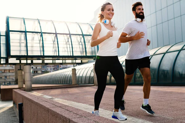 Young Fitness Couple Running Together Urban Area — Stock Photo, Image