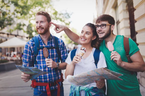 Tourist group of  friends discovering city on foot and travelling