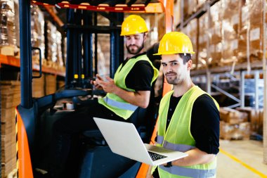 Logistics people working in warehouse  clipart