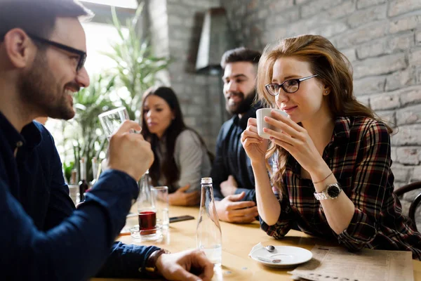 Colleagues from work socializing in restaurant — Stock Photo, Image