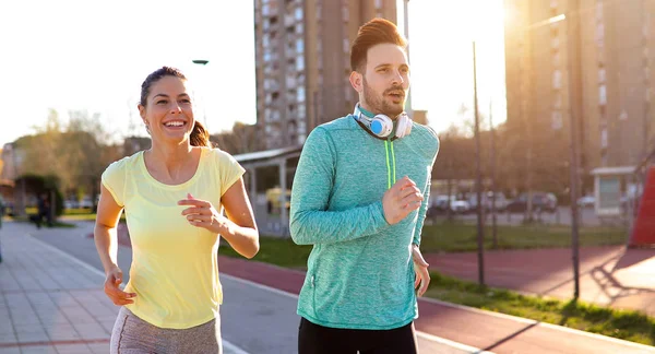 Young Fitness Couple Running Together Urban Area — Stock Photo, Image
