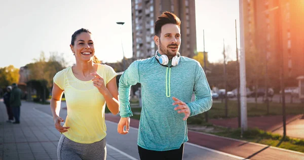 Young Fitness Couple Running Together Urban Area — Stock Photo, Image