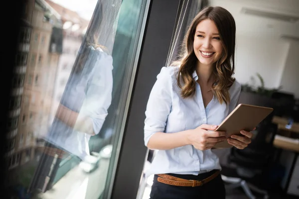 Young Businesswoman Using Digital Tablet While Standing Front Windows Office — Stock Photo, Image