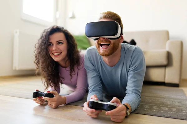 Happy Young Couple Playing Video Games Virtual Reality Headsets Home — Stock Photo, Image