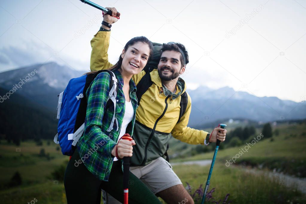 Portrait of happy couple having fun on their hiking trip