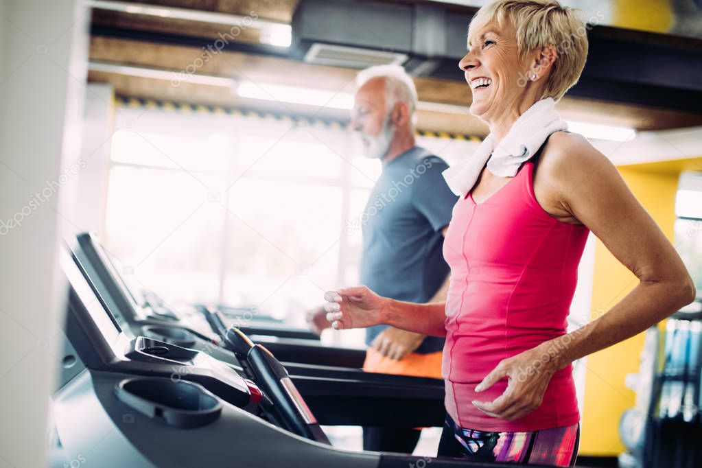 Image of attractive fit mature woman in gym