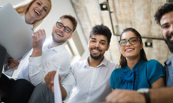 Successful happy group of students learning software engineering and business during presentation