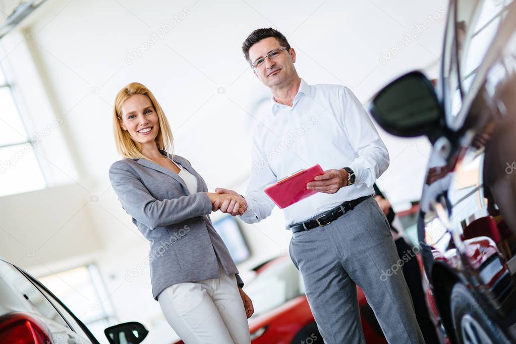 auto business, car sale, consumerism and people concept - happy man at auto show or salon