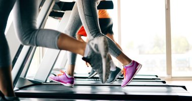 Picture of people doing cardio training on treadmill in gym clipart