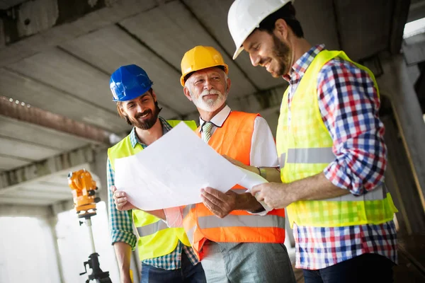 Confident Team Architects Engineers Working Together Modern Construction Site — Stock Photo, Image