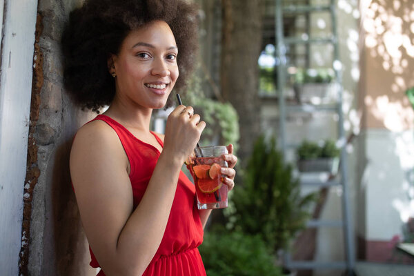 Portrait of black woman, model of fashion wearing dress with afro hairstyle