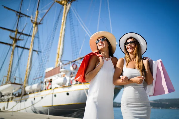 Luxurious life for two women walking and shopping on summer vacation