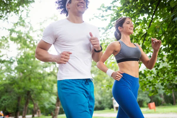 Couple jogging and running outdoors in nature — Stock Photo, Image