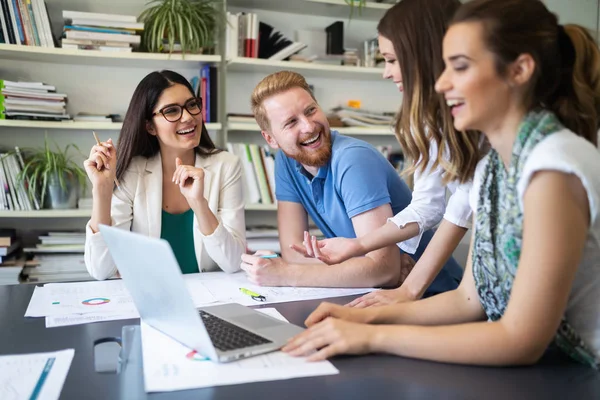 Cheerful coworkers, business people in office during company meeting