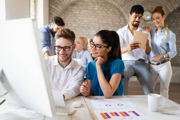 Successful happy business group of people at work in office