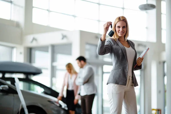 Young Beautiful Female Car Sales Consultant Working Showroom — Stock Photo, Image