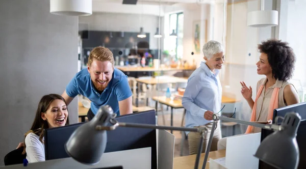 Group of successful happy business people at work in office