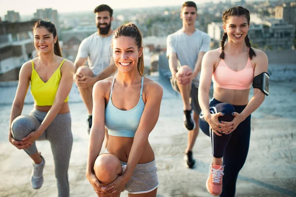 Group Smiling Fit Happy People Doing Power Fitness Exercise