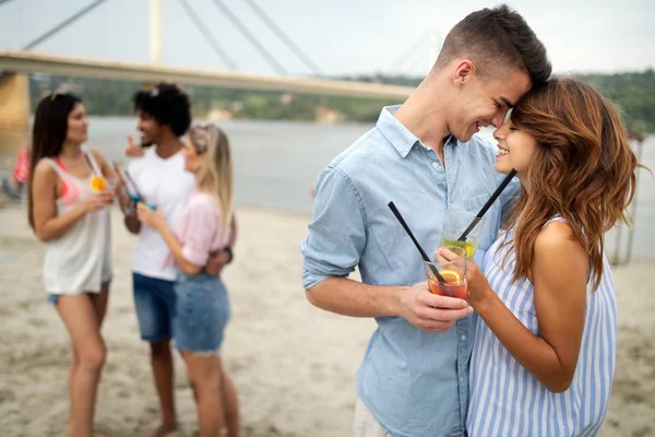 Group of young people enjoying outdoor summer party