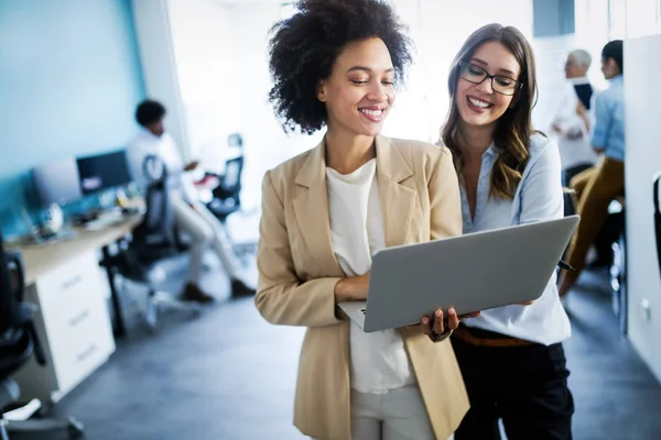 Group of successful happy business people at work in office