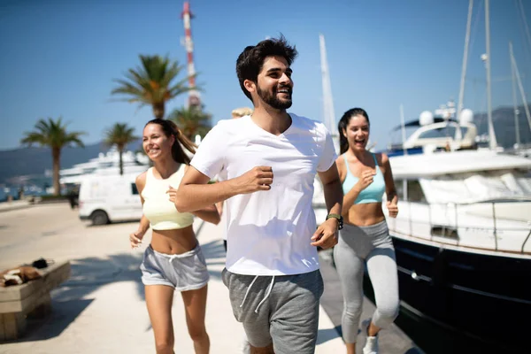 Healthy group of people jogging and enjoying friend time together