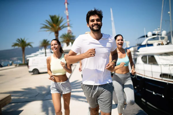 Healthy group of people jogging and enjoying friend time together