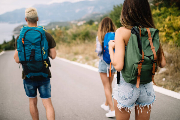 Group of friend traveler walking and having fun. Travel lifestyle and seasonal vacation concept