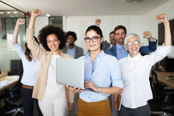 Business team celebrating a good job in the office — Stock Photo, Image