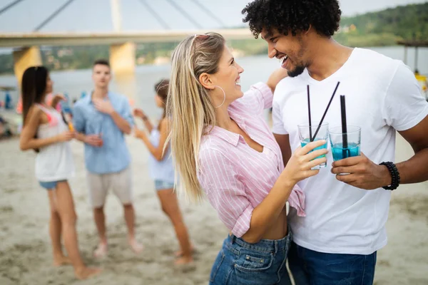 Group of young people enjoying outdoor summer party