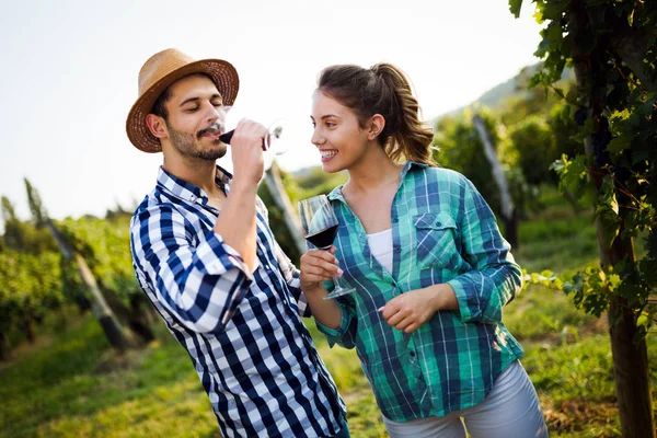 Couple in love working at winemaker vineyard