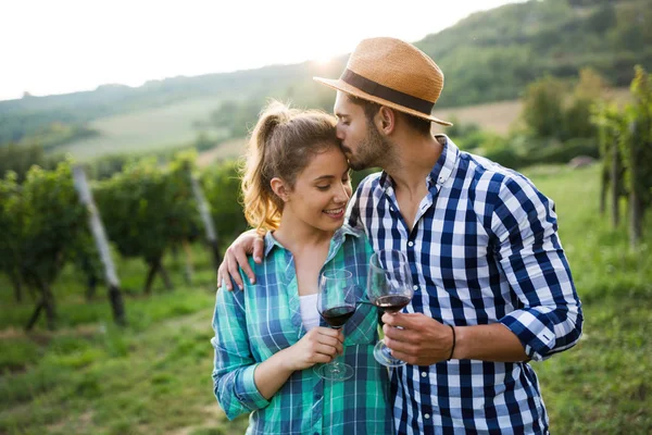 Couple in love working at winemaker vineyard
