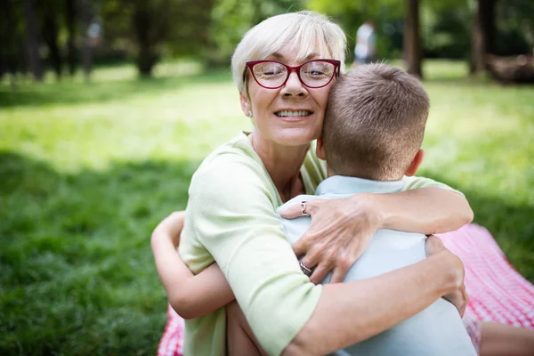 Tender Moment Loving Senior Woman Embracing Her Grandchild Cheerful Smile — Stock Photo, Image