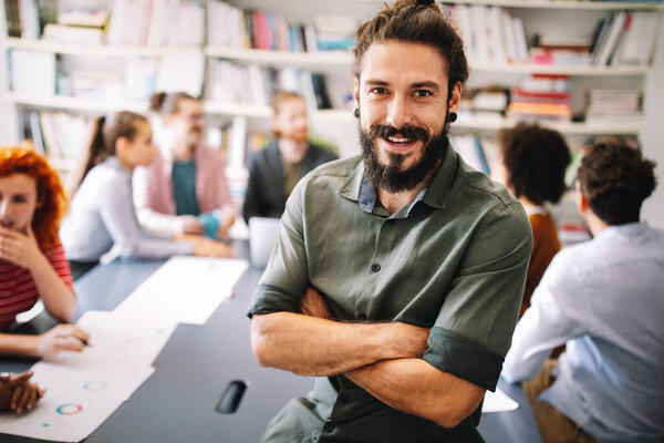 Collaboration and analysis by business people working in modern office