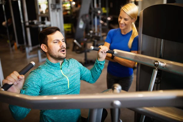 Happy Fit Young Man His Personal Trainer Doing Exercise Gym — Stock Photo, Image