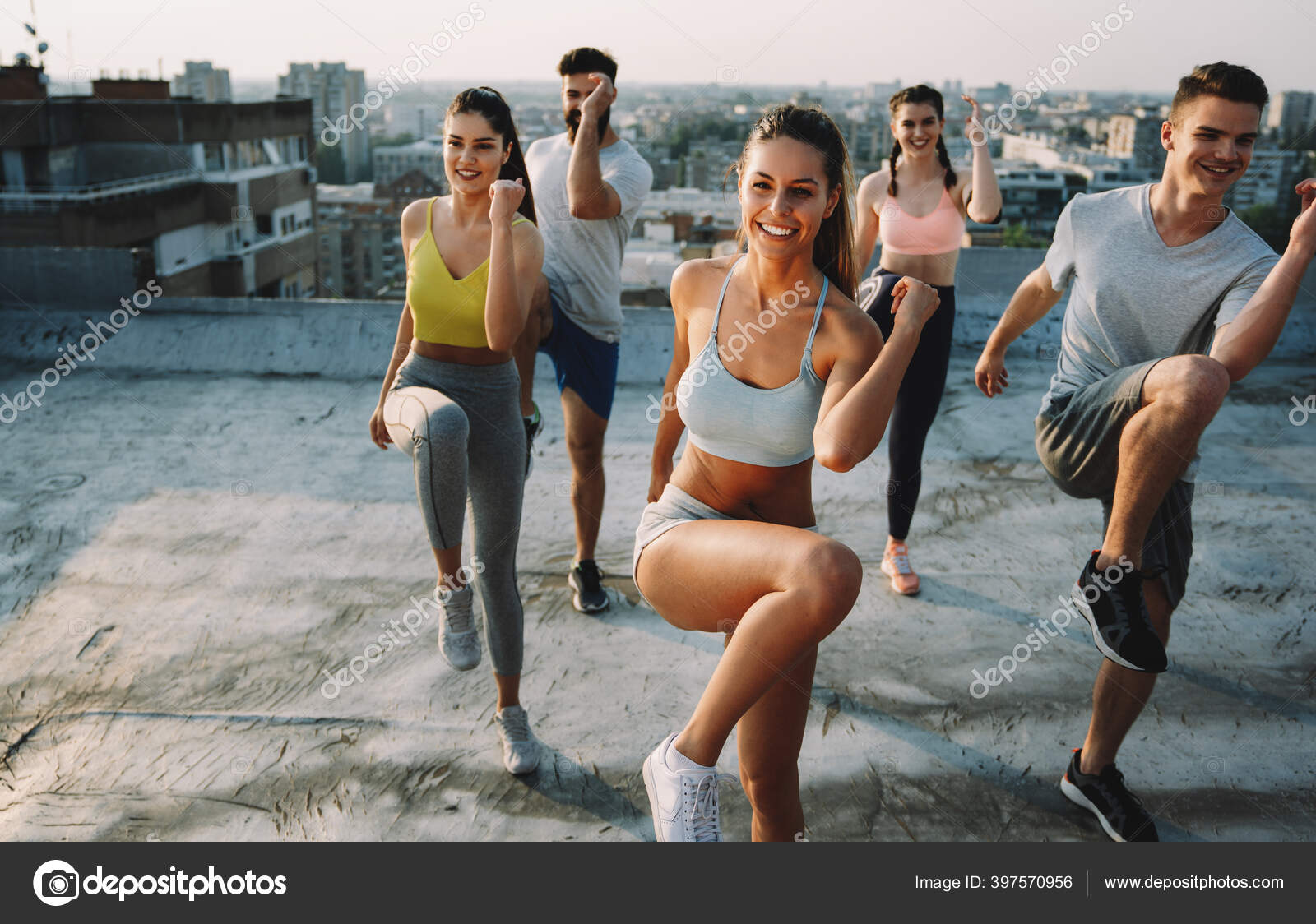 Group Smiling Fit Happy People Doing Power Fitness Exercise