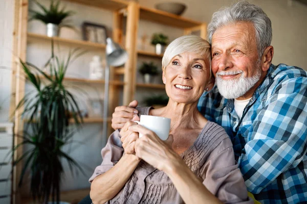 Happy Smiling Senior Couple Embracing Together Enjoying Retirement Home — Stock Photo, Image