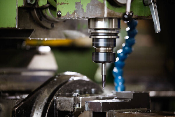 Machine tool in metal factory with drilling modern cnc machines