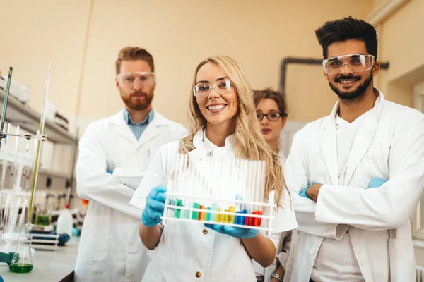 Group of medical scientists working at the laboratory. Research team virus people concept