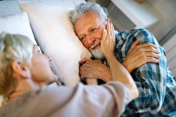 Happy Mature Couple Embracing Sleeping Together Bedroom Stock Photo