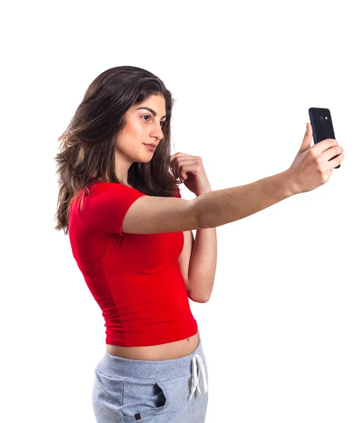 Glada Attraktiv Ung Idrottskvinna Med Mobiltelefon Vit Bakgrund — Stockfoto