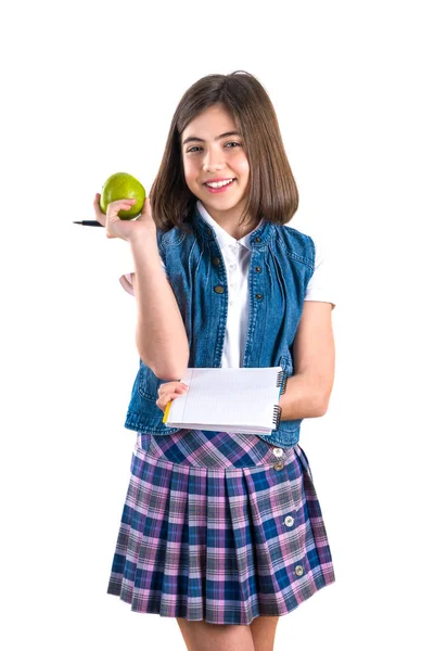 ノートブック 白い背景の上のリンゴの女子高生 — ストック写真