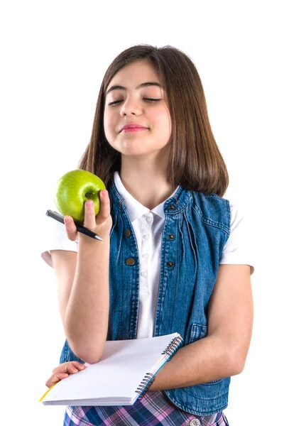 Schulmädchen Mit Notizbuch Und Apfel Auf Weißem Hintergrund — Stockfoto