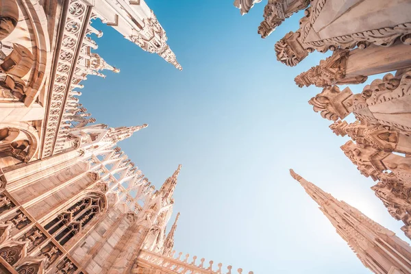 view of Gothic architecture and art on the roof of Milan Cathedral (Duomo di Milano), Italy.
