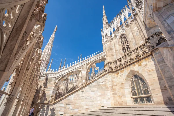view of Gothic architecture and art on the roof of Milan Cathedral (Duomo di Milano), Italy.