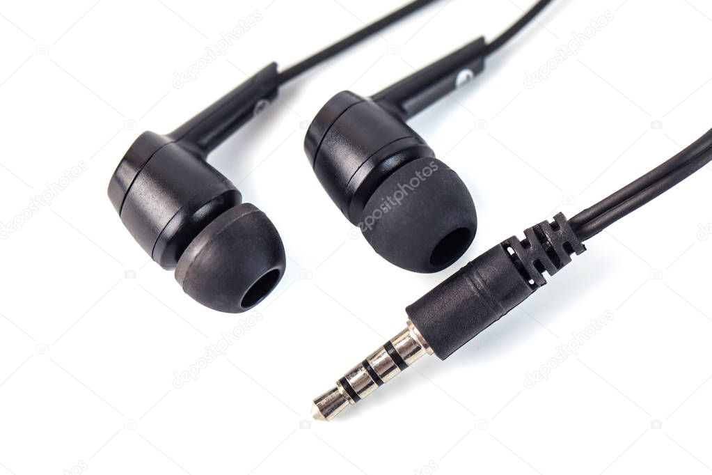 Black headphones on a white background, close up.