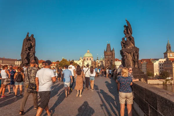 Prague, Czech Republic - 20.08.2018: People are walking over the famous Charles Bridge in Prague.