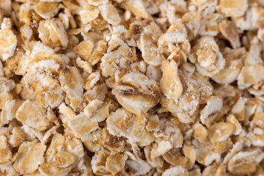 Haddelenmiş yulaf arka plan. Organik yulaf ezmesi arka plan dokusu, makro fotoğraf