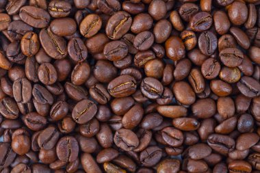 Kavrulmuş kahverengi kahve çekirdekleri model, arka plan, üstten görünüm.