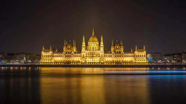 Hungarian Parliament Building on the bank of the Danube in Budapest at night.